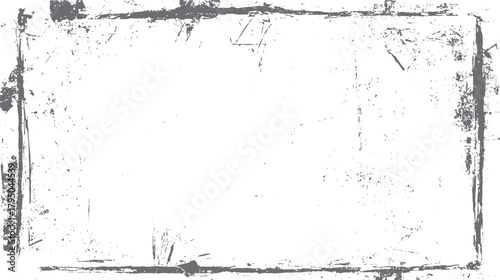 Grey distressed grunge border frame with white background and scattered speckles and scratches texture