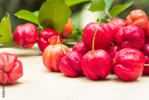 Photos acerola cherry on wood top table