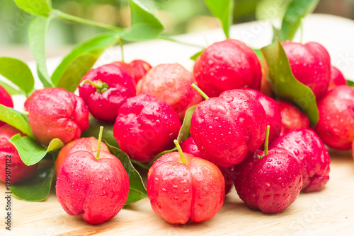 Photos acerola cherry on wood top table