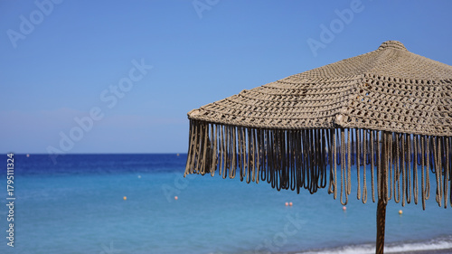 A close-up sunshade with copy space on the beach of Rhodes dodecanese islands - Greece 