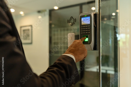 Cuadro en lienzo Hand of employee touch fingerprint scan of biometric attendance machine security