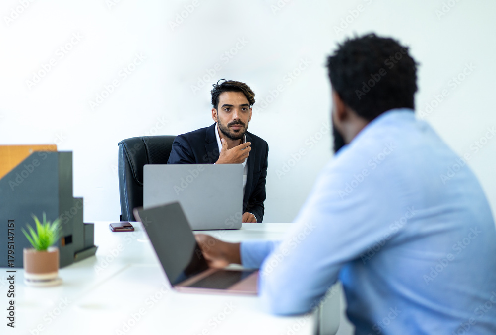 © PINA - businessman colleague discuss explain budget performance planning, sharing idea for cost reduction, business people man diverse employee coworker in formal suit meeting in finance office © PINA - businessman colleague discuss explain budget performance planning, sharing idea for cost reduction, business people man diverse employee coworker in formal suit meeting in finance office