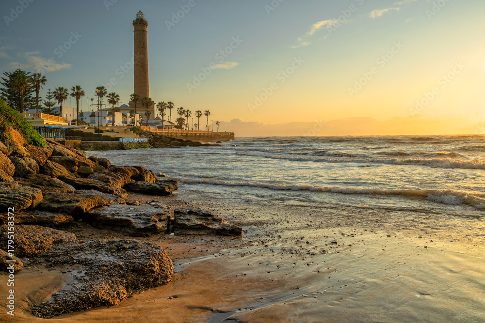 Fototapeta premium Chipiona, Spain. Chipiona Lighthouse on the Ocean Shore. Sea travel and tourism, Atlantic 