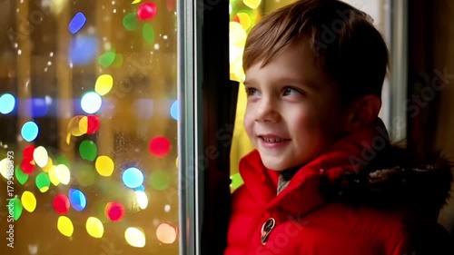 Child looking at glowing lights across winter landscape. Noel and new year related footage.