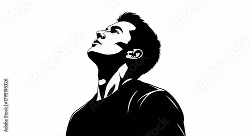 Monochromatic portrait of a man looking upwards with determination.