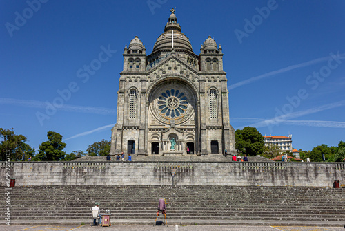 Viana do Castelo, Portugal. Frontal view of the Sanctuary of Santa Luzia showing its granite facade, rose window and domes on a clear sunny day