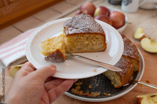 A piece of easy and fluffy apple sponge cake fresh and homemade bake on a plate