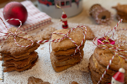 German speculoos cookies made with cookie cutters on decorated background