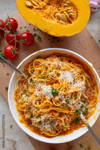 Delicious homemade Spaghetti with tomato pumpkin sauce and parmesan cheese, Healthy food