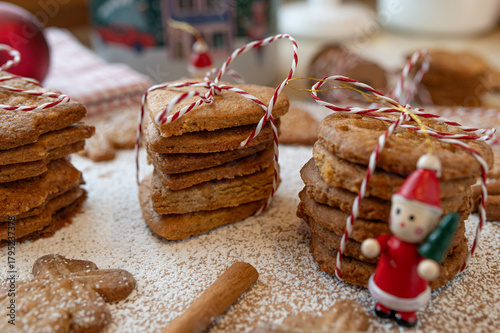 German speculoos cookies made with cookie cutters on decorated background