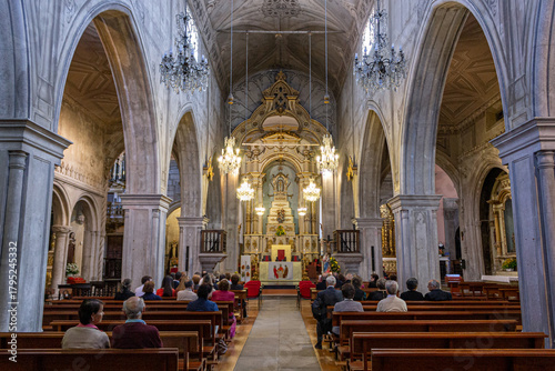 Viana do Castelo, Portugal. Interior of the Se Catedral de Viana do Castelo, a 15th century Gothic and Manueline church, showing the nave, stone arcades, and liturgical furnishings under soft light