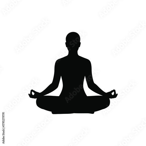 Silhouette of a person meditating in a lotus pose