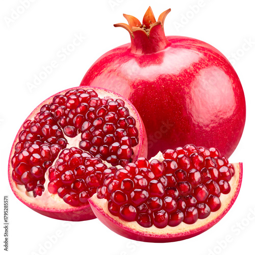 Vibrant ripe pomegranate fruit whole and cut open revealing juicy arils 