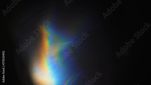 Abstract black motion background with subtle light leaks creating mysterious and cinematic atmosphere, perfect for film intros and evocative visuals