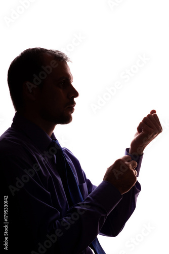 Thoughtful young unshaven man, business clothes, silhouette - white background isolate