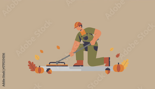 Professional worker cleaning floor surface with a squeegee surrounded by autumn elements