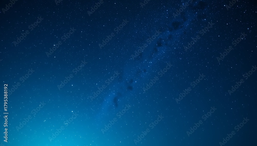 Fototapeta premium Vast clear night sky showcasing countless stars and a faint milky way galaxy stretching across