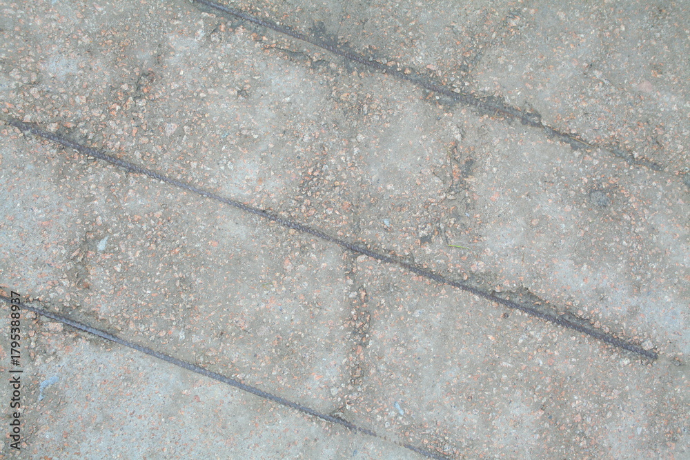 Obraz premium Concrete wall texture with rough surface and natural imperfections. Grey industrial background for design, construction concepts and architectural materials.