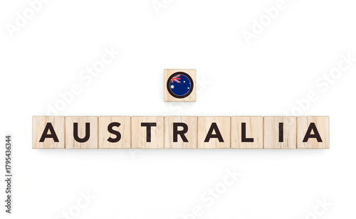 Wooden blocks bearing the name and flag of Australia. Australian and Austral Culture, national identity, travel, and geography in a copy space design.