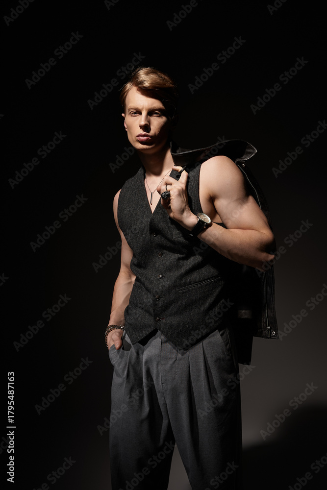 Obraz premium Young man showcasing modern masculinity in stylish urban attire