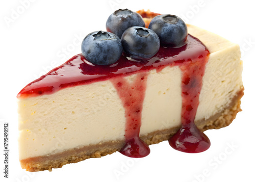 Slice cheesecake displays blueberries and red jam dripping down in a transparent background