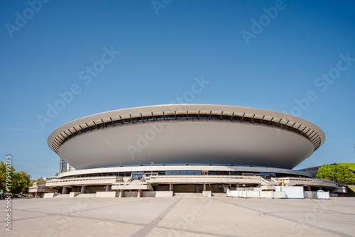 Spodek Arena in Katowice, Poland, on a sunny day with clear blue sky