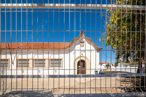 View of a school building behind a fence in Vila Nova de Milfontes, Alentejo, Portugal
