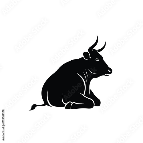 A simple black silhouette of a resting bull facing towards the right.