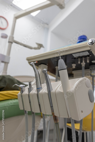 Set of dental instruments in holder in modern clinic.