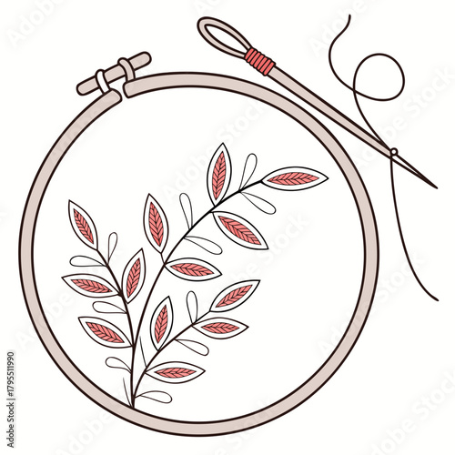 Embroidery hoop with a delicate branch and leaves being stitched with a needle and thread