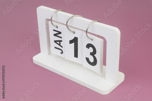 January, 13 on calendar on purple background.