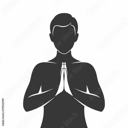 Silhouette of a person in a meditative pose with hands clasped in front of chest