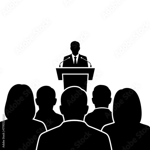 Silhouette of a speaker at a podium addressing an audience
