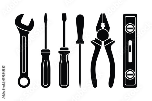 Set of various hand tools including a wrench, screwdrivers, pliers, and a level