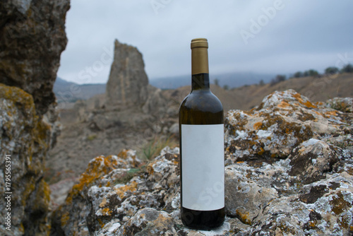 A bottle of wine in the mountains