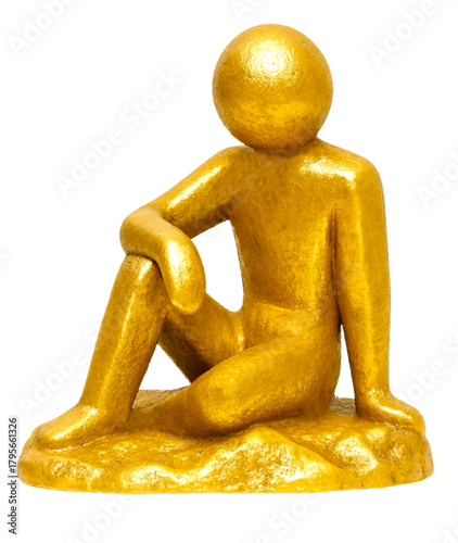 Golden figurine of a seated human symbol on a textured base