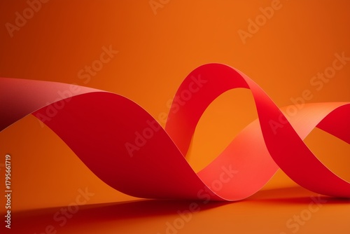 Bright Red Ribbon Creates Flowing Shapes Against a Vibrant Orange Background ...