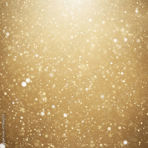 Golden glittering particles and bokeh on abstract festive background.