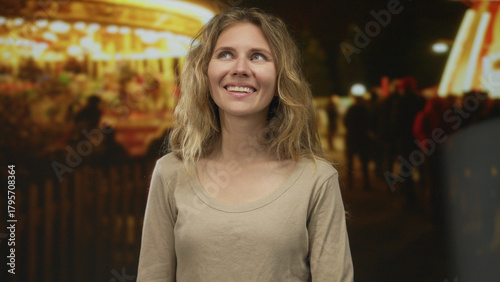 Wallpaper Mural Woman face smiling night carnival lights blonde portrait outdoor casual snapshot capturing festive vibe. Torontodigital.ca