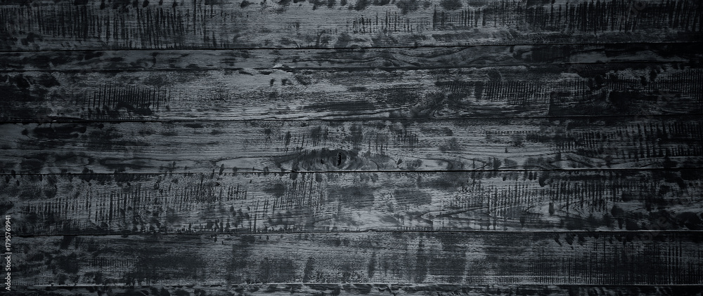 Obraz premium Old grunge dark textured wooden background with deep. rich tones, surface of aged wood, featuring prominent grain patterns, cracks, scratches, weathered imperfections.