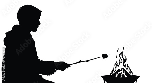 Person roasting marshmallow over campfire silhouette