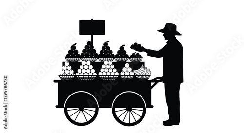 Fruit vendor selling produce from cart apples