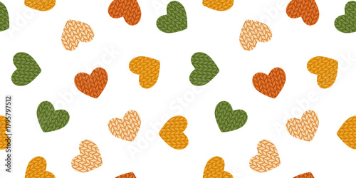 Vector seamless pattern with cute knitted hearts in orange, beige, green, and yellow on white background. Cozy autumn print for fabric, textile, wrapping paper, and seasonal greeting design.