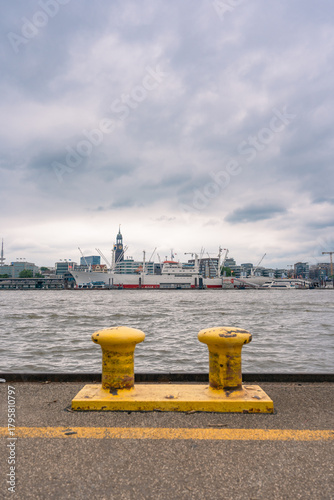 Elbe River with yellow bollards in the foreground