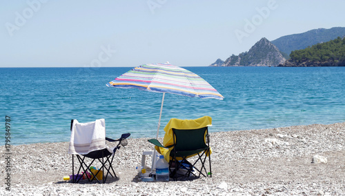 Fototapeta Naklejka Na Ścianę i Meble -  beach chairs and umbrella on the beach of Turkey