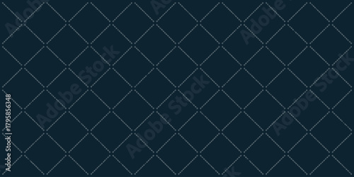 Dark blue quilted fabric with diamond pattern and faint white stitching running along the lines