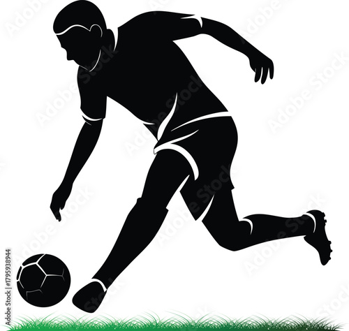 Silhouette of football player in action with soccer ball