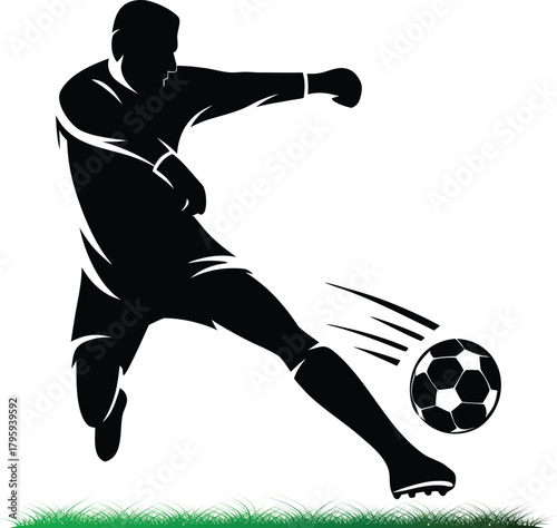 Silhouette of soccer player kicking ball across grass field