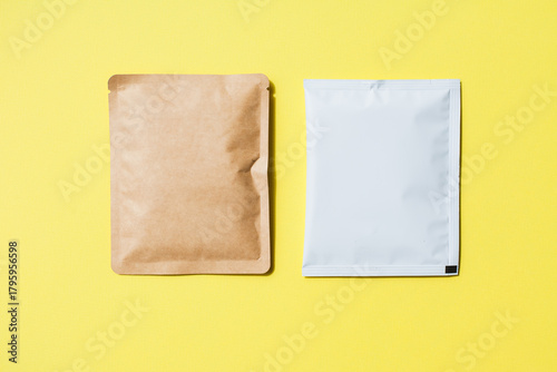 Blank craft plastic pouch, white pack on studio background with shadow, mylar bag isolated for coffee or food, cosmetic products, snack, candy. Different sizes, mock up.