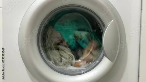 Cleaning hospital uniforms using industrial washing equipment